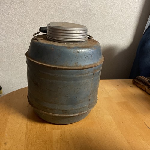 Antique round metal thermos - round,